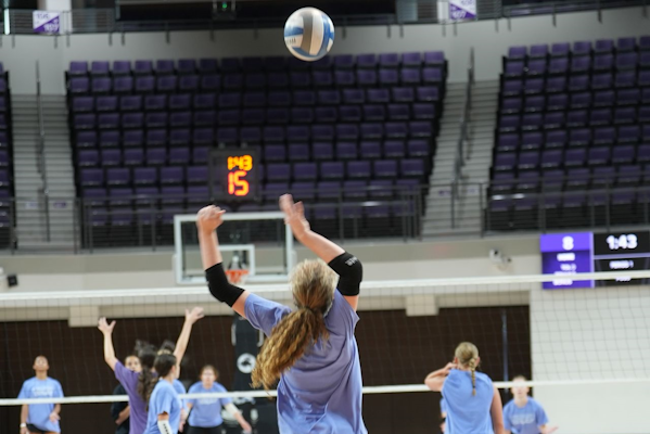 Player serving a volleyball